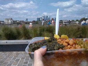 Mixed box with rice by the River Thames. Comforting and tasty. Spiced up with Red and Green Chilli sauces. at Red Tent Ethiopia in South East London
