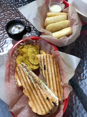 Cuban sandwich, coffee, and yuca fries.  at Equelecua Cuban Cafe - Cloud Kitchen in Los Angeles