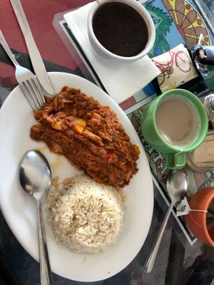 I think this one was shredded beef and it was served with rice and beans. I absolutely loved it! It was really flavorful and a bit sweet because of the yellow bell peppers. I’m a good eater but the plate will make you full haha. Also pictured in the green cup is a tropical tea latte with pineapple flavor. Trust me you HAVE to try it! I ordered it with almond milk. No sweetener added. I’m obsessed with this drink now!! at Equelecua Cuban Cafe - Cloud Kitchen in Los Angeles