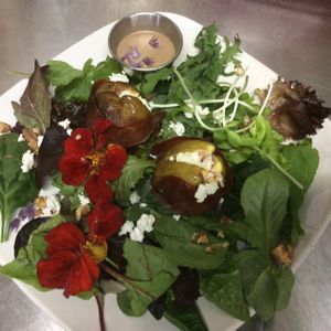 Prosciutto-wrapped, goat cheese-stuffed roasted fig salad over local greens. at The Pearl Cafe in Chehalis