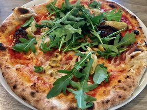 Vegan pizza with wholewheat crust at Jurgis ir Drakonas in Vilnius