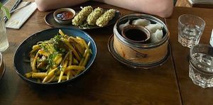Mango salad, tofu with green rice and dumplings at Soy in Berlin