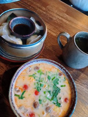 Coconut soup and dumplings at Soy in Berlin