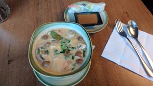 great coconut milk soup and a summer roll with peanut sauce at Soy in Berlin