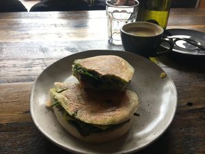 Vegan toastie - 15 dollars, and oat flat white   at Livefast Cafe in Halls Gap