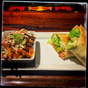 Mexi-fries and a spicy Chickun wrap at the Buck!  at The Buckingham in Edmonton