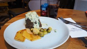 Haggis [£12.25] with Steamed and Pickled Turnip, Roasted Brussel Sprouts and Tarragon Whisky Sauce at Henderson's Vegan in Edinburgh