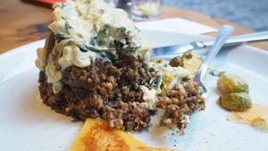 Haggis [£12.25] with Steamed and Pickled Turnip, Roasted Brussel Sprouts and Tarragon Whisky Sauce at Henderson's Vegan in Edinburgh