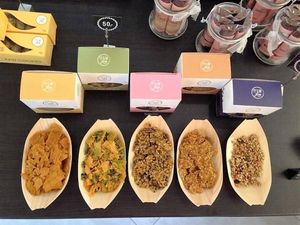 Samples to try for free: Different raw stuff to buy/take away: crackers, chips, granolas... at The Raw Deli in Prague