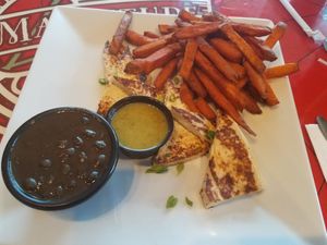 Tofu entree with sweet potato fries and black beans. Very tasty! at Gas Full Service Restaurant  in St Augustine