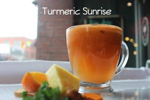 Turmeric, ginger, red apple, lemon, orange, and carrots at Live Juice in Concord