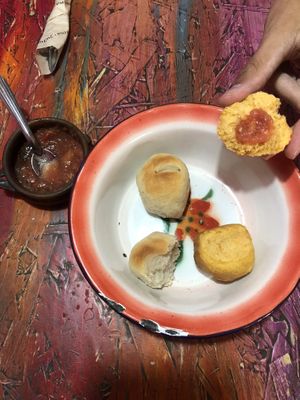 Four free, soft, little buns with a semi-spicy tomato salsa.  at Pacha Manka in Humahuaca