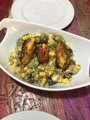 Warm quinoa salad with little potatoes, corn, almond feta, green Lima beans and herbal grilled tomatoes.  at Pacha Manka in Humahuaca