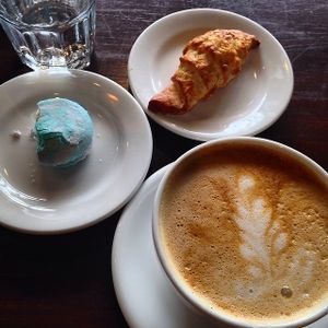 Pumpkin spice latte, cotton candy macaron, and croissant at Passion Flour Patisserie in Salt Lake City