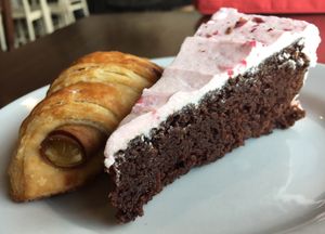 Chocolate cake with raspberry frosting, ham & cheese croissant  at Passion Flour Patisserie in Salt Lake City