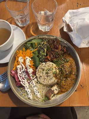 Whole food bowl and spiced apple juice  at Veggie Vie in Adelaide