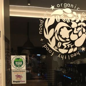 6BT proudly displaying their HappyCow Excellent Reviews decal at Cafe the 6BT in Tokyo
