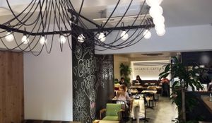 The light fixture in the entryway is cool; kind of reminds me of an octopus. Too bad the food is bland and unsatisfying and the service is atrocious. at Cafe the 6BT in Tokyo