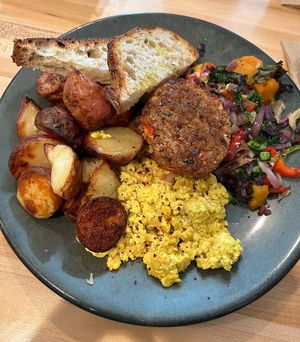 Vegan Farmer’s Choice (sourdough toast, potatoes, tofu scramble, veggie sausage, veggie hash)  at The Farmer's Daughter in North Easton