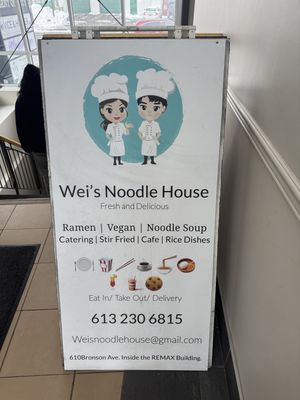 Sign just as you enter to go to the basement restaurant   at Wei's Noodle House in Ottawa