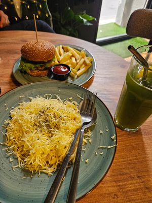 Pasta with cheese sauce and cheeseburger/fries at Kiwi Vegan Cafe in Tbilisi