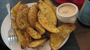 Potato wedges, were really fresh and yummy, come with kind of a thousand island dipping sauce.  at Kiwi Vegan Cafe in Tbilisi
