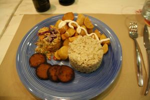 Dinner of the day, vegan sausage, fried potatoes with aioli, couscous and rice.  at Casa Griega in Barcelona