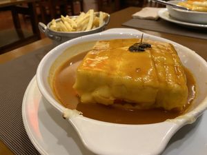 Tofu Francesinha with a side of fries (paid separately )  at Francesinhas Al Forno da Baixa in Porto