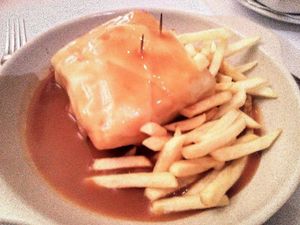 Seitan Francesinha with french fries and v-cheese the one I ate at Francesinhas Al Forno da Baixa in Porto
