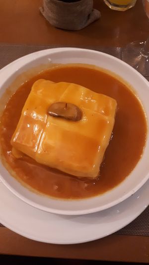 tofu francesinha (very good 😋) at Francesinhas Al Forno da Baixa in Porto
