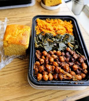 Jerk chickpeas,  collard greens, mashed sweet potatoes and cornbread 😋. at The Nile Cafe in Philadelphia