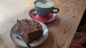 Vegan cinnamon cranberry bread, latte with oat milk.  at Airtime Cafe in Lauterbrunnen