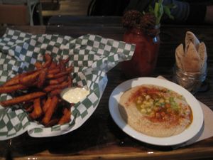 Sweet potato fries with vegan mayo, small serving of hummus with pitas and Buddy Caesar  at Panthere Verte - St. Denis in Montreal