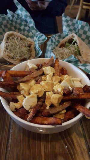 Karma shawarma, falafusion, and an order of poutines with tofu curds. at Panthere Verte - St. Denis in Montreal