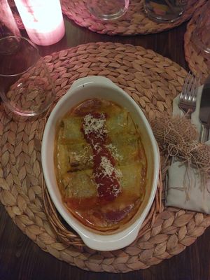 Crespelle al Forno (Crêpe gefüllt mit hausgemachtem Ricotta und Spinat, mit Tomatensoße und veganem Käse) at Paletti Die Genuss Bar in Neu-isenburg