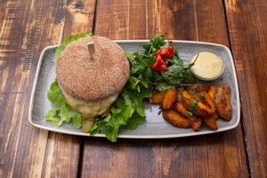 Chef Burger with "Cheese" Sauce and Potato Wedges at Paletti Die Genuss Bar in Neu-isenburg