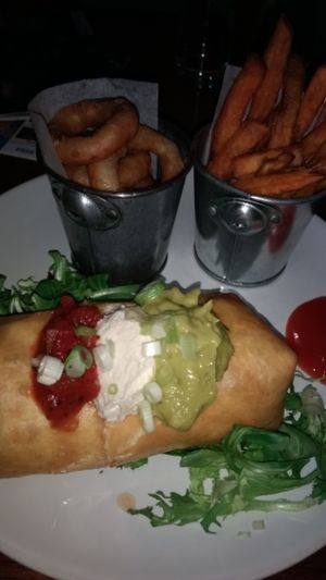 vegan chimichanga,sweep potato fries and onion rings.  at The Bohemian in Newcastle Upon Tyne