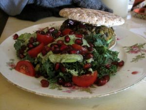 Lentil burger with a side salad (kale, pomegranate, avocado). This is one of my favorite things at Doggy Café. at Le Doggy Cafe in Montreal
