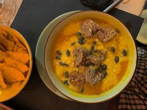 pumpkin creamy soup with vegan cheese  at Buddy VEGGY in Rome