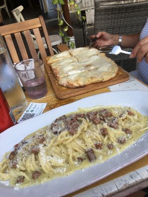 Carbonara and 4 cheese pizza   at Buddy VEGGY in Rome