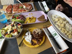 Pizza margarita, vegan omelette, carbonara, pancakes with chocolate, fruit bowl.  at Buddy VEGGY in Rome
