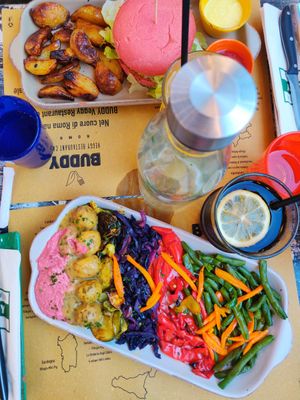Lemon lentil balls and beyond meat burger in the back at Buddy VEGGY in Rome