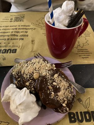 Hot chocolate with whipped cream and chocolate pancakes for dessertt  at Buddy VEGGY in Rome