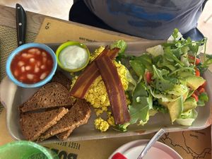 English breakfast con tofu strapazzato, vegan bacon, fagioli, veg formaggio morbido e insalatina con avocado  at Buddy VEGGY in Rome