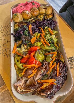 Chickpea-lentil meatballs on beetroot hummus with vegetables  at Buddy VEGGY in Rome