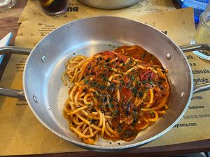 Spaghetti puttanesca with tomato puree, olives, capers, oregano and tuna  at Buddy VEGGY in Rome