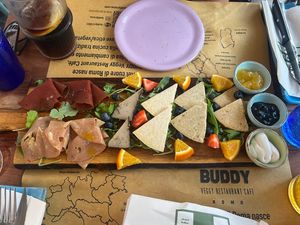 Platter of cheeses made with cashews and chickpeas plus vegan cured meats  at Buddy VEGGY in Rome