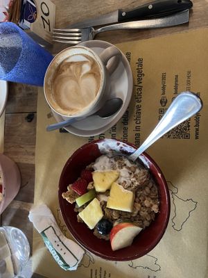 Musli with soy yogurt, soy cappuccino, and we added a bowl of fruit to round it outt  at Buddy VEGGY in Rome