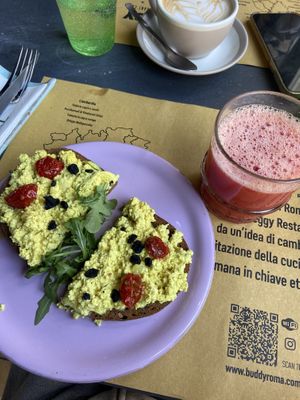 Tofu scramble bruschetta and red orange juice   at Buddy VEGGY in Rome