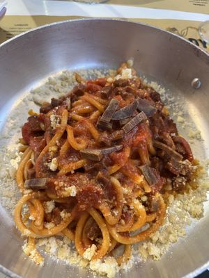 Vegan Amatriciana

Tomato sauce, *vegan bacon, vegan cheese.  at Buddy VEGGY in Rome